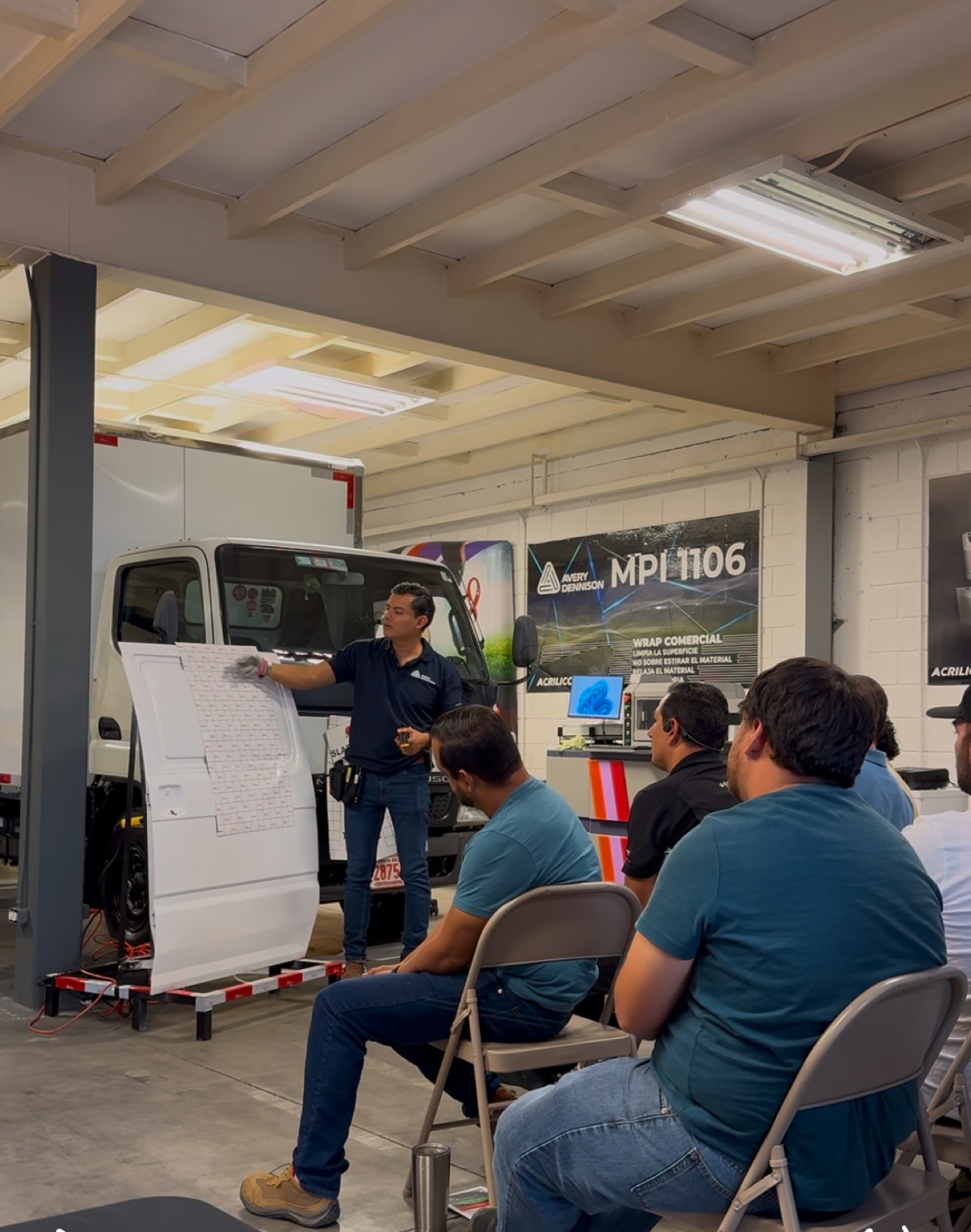 Emmanuel Rodríguez teaching Avery Dennison MPI 1106 installation techniques